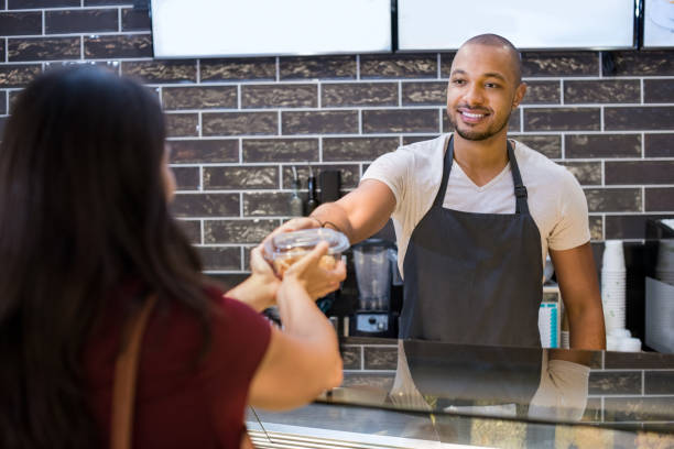 istock Waiter giving take away food 693280432