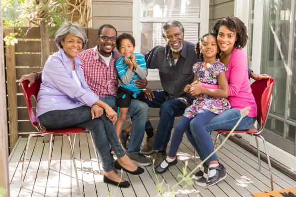 istock Three generation African American family sitting on patio 693289746