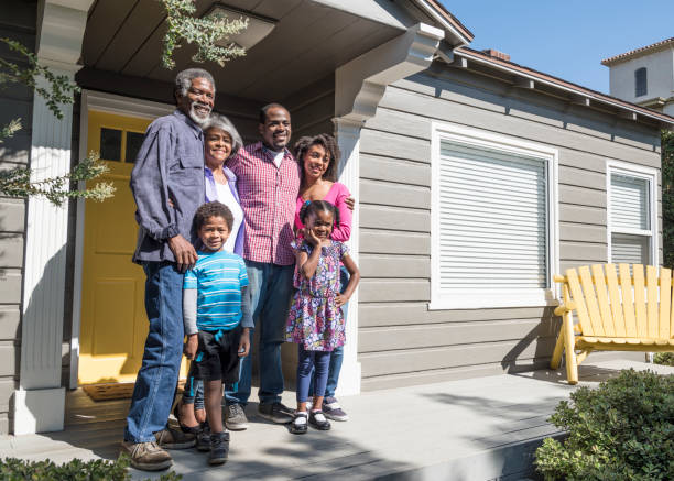 istock African American family by front door, smiling 693290072