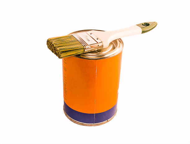 istock Brush lying on the jar with a paint isolated on white background 693293174