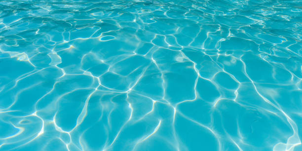 istock Blue ripple wave and water surface in swimming pool 693293408