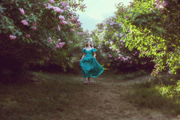 istock Woman runs through the garden. 693294268