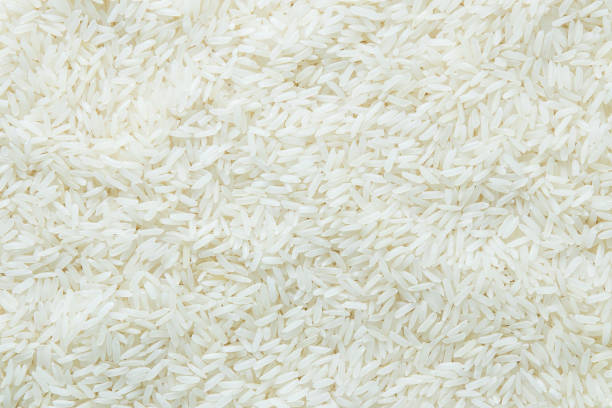 istock Close up  grains of jasmine rice texture background. 693297768