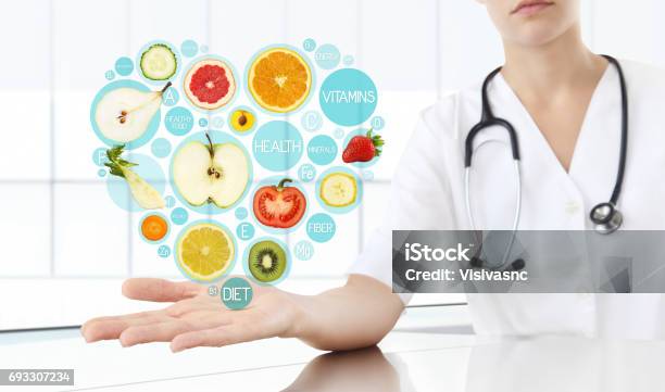 Healthy Food Supplements Concept Hand Of Nutritionist Doctor Showing Symbols Fruits In Hearth Shape Stock Photo - Download Image Now