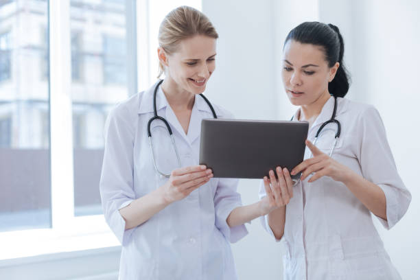 istock Involved doctors using digital device at the hospital 693307354