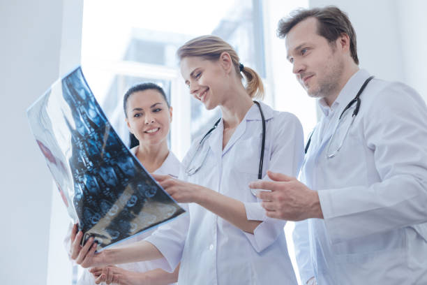 istock Glad oncologists discussing ct scan result in the clinic 693310078
