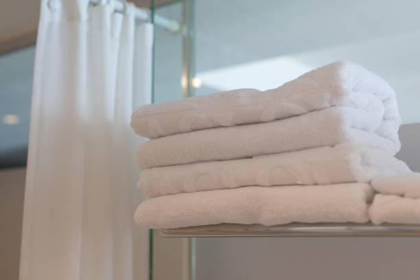 istock stacked white towels in hotel bathroom 693310772