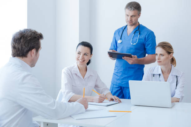 istock Energetic oncologists enjoying morning routine at the hospital 693311384