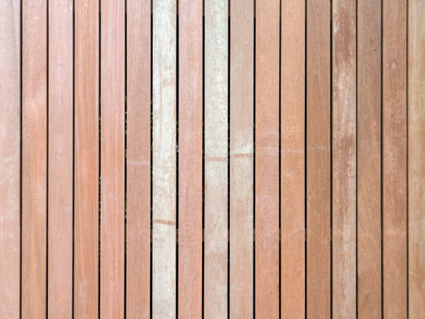 istock Natural wooden striped fence textured background 693314506