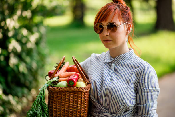 istock Walking Through Park On Sunny Day With Hands Full Of Vegetables 693318494