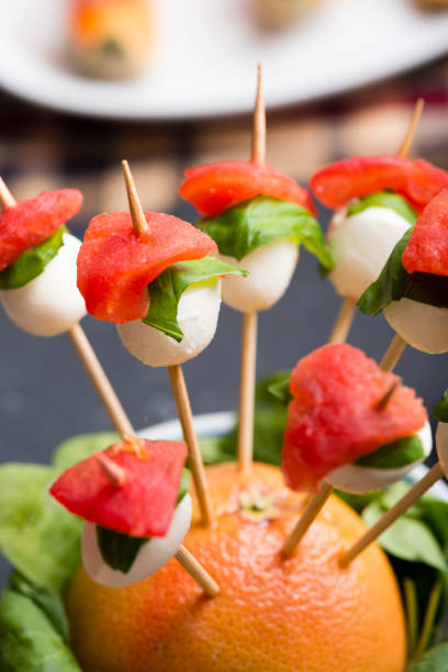 istock Tomato mozzarella skewer and other freh finger food. 693318552