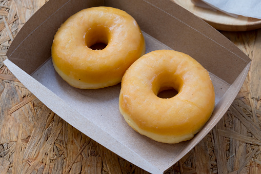 Donuts sugar, sweet in paper brown box