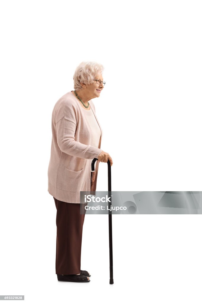 Reife Frau mit einem Stock in der Schlange - Lizenzfrei Stehen Stock-Foto