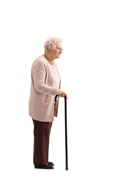 istock Mature woman with a cane waiting in line 693321828