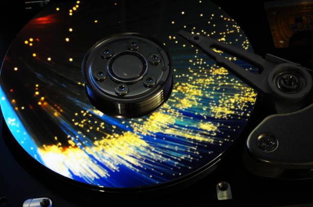 istock Close Up of Open Computer Hard Disk Drive with light effects and reflex. Background. 693322758