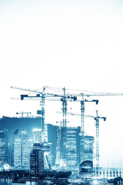 istock Double exposure of construction crane with city 693323596