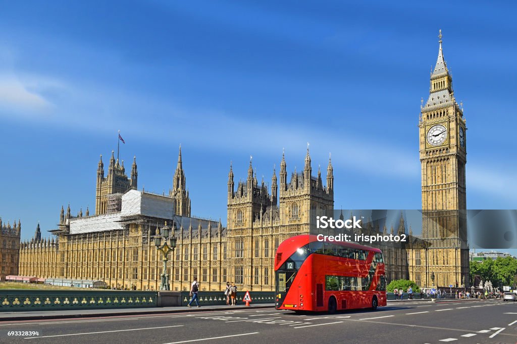 Houses of Parliament and Big Ben in London double-deck red bus on Westminster Bridge with Big Ben and Houses of Parliament on the background in London, UK London - England Stock Photo