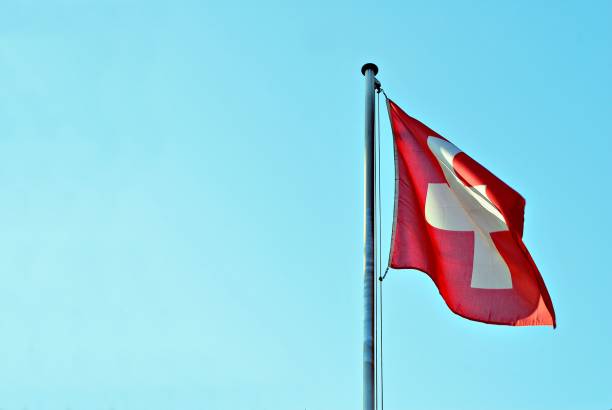 istock Swiss flag blowing in the wind 693332066