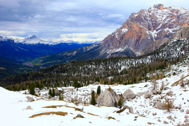 istock Idyllic Langkofel snowcapped mountain range above Val Gardena and storm clouds, dramatic panorama and majestic Dolomites, Italy tirol alps 693336406