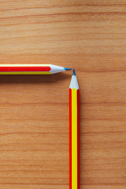 istock Colorful pencils on wooden background 693352572