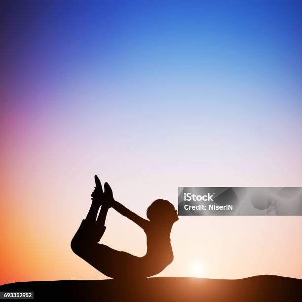 Woman In Bow Yoga Pose Meditating At Sunset Zen Stock Photo - Download Image Now - Above, Active Lifestyle, Adult