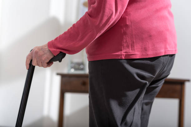 年配の女性が杖歩行 - human hand aging process senior adult cane ストックフォトと画像