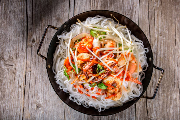 istock Delicious Asian Noodle with Bean Sprout , Shrimp   and Pan Fried Fish Cake 693360086