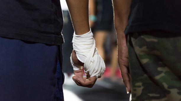 Male sportsman is preparing for boxing training
