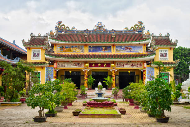 istock Chua Phap Bao buddhist temple with little bonsai tree in yard. 693369674