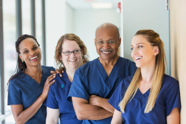 istock Man leading team of multi-ethnic medical professionals 693369728