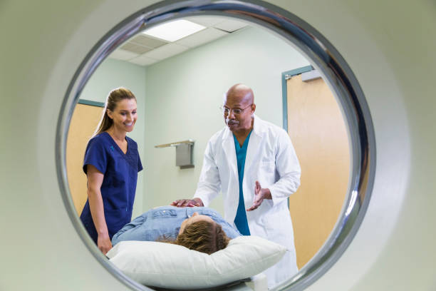 istock Doctor and nurse with patient having CT scan 693370652