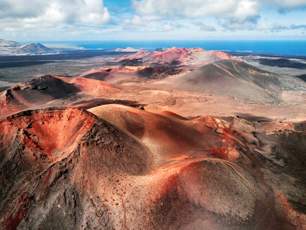 Volcanic landscape, Timanfaya National Park, Lanzarote, Canary Islands Volcanic landscape panorama, Timanfaya National Park, Lanzarote, Canary Islands, Spain dormant volcano stock pictures, royalty-free photos & images