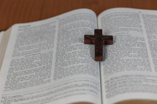 istock Bible, cross and money 693377628