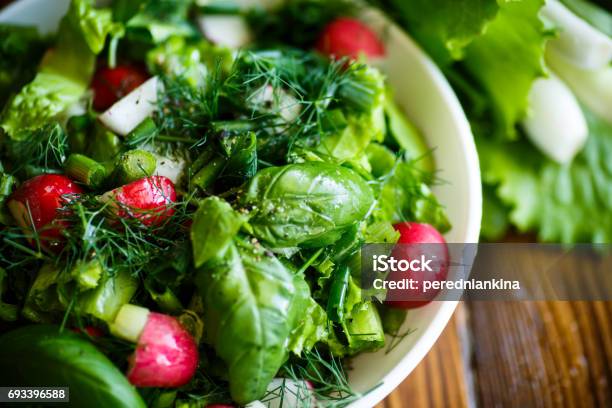 Spring Salad From Early Vegetables Lettuce Leaves Radishes And Herbs Stock Photo - Download Image Now