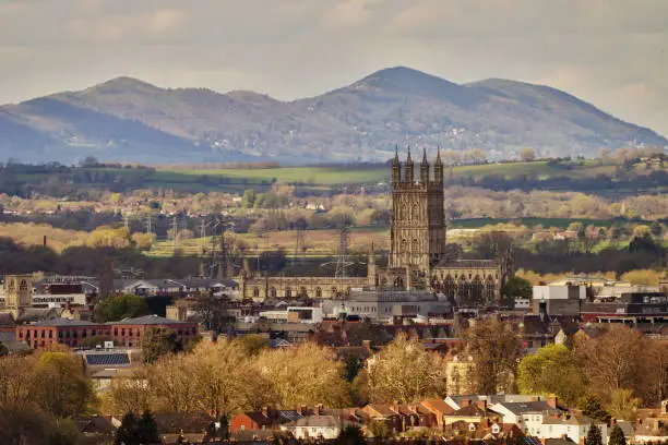 Gloucester cathedral with mountain in background.