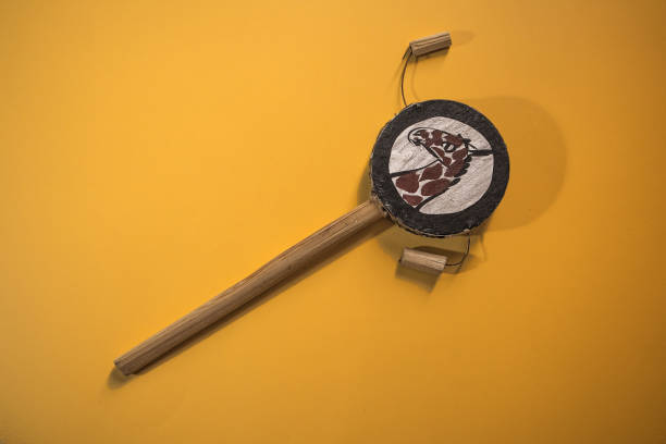 African music instrument isolated on yellow background