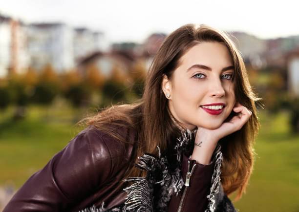 istock beautiful girl has a rest day in the park 693404086