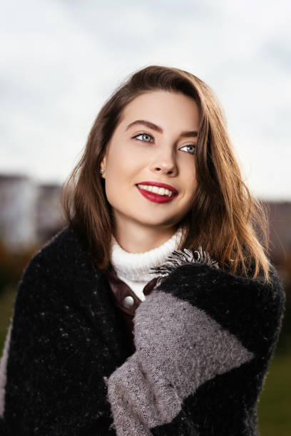 istock beautiful girl has a rest day in the park 693404106
