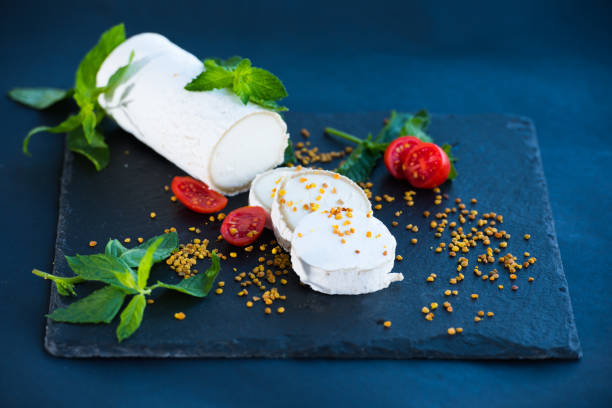istock Goat Cheese on black Plate with Pollen 693412666