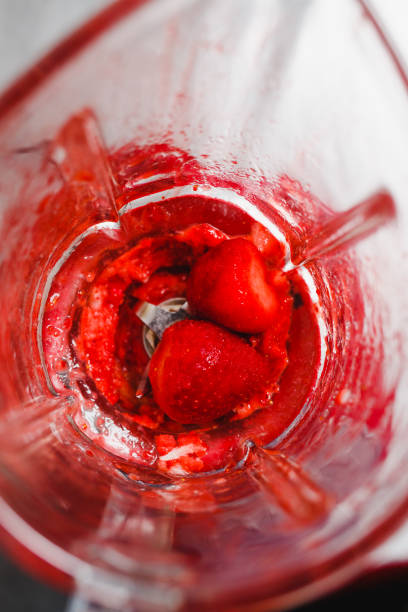 istock Strawberry in a blender top view 693412826