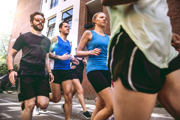 istock Urban runners crew training in the city 693413264