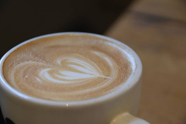 istock Cup of cappuccino with a heart design 693422862