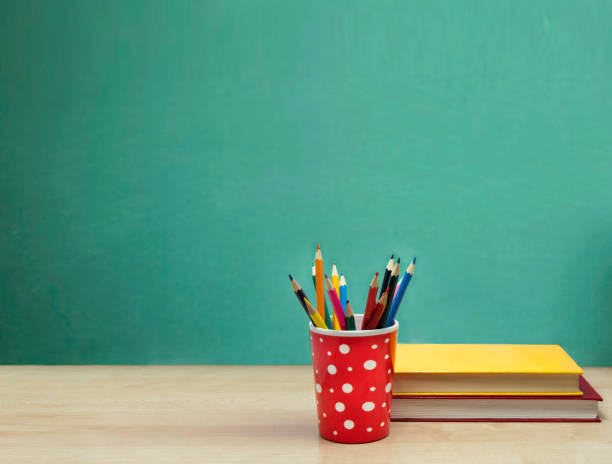 istock Colorful books on a wooden table. 693423420