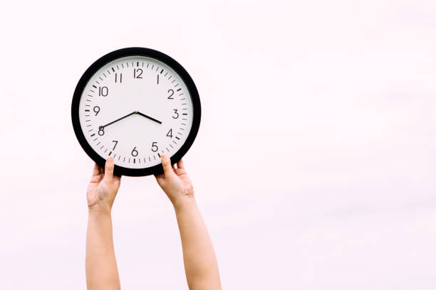 istock Classical round hours against  background of sky 693423584