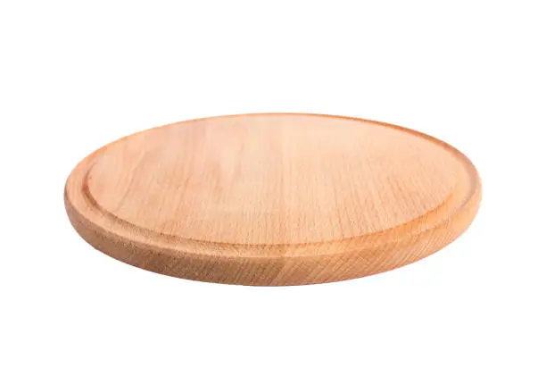 Photo of round wooden cutting Board isolate.