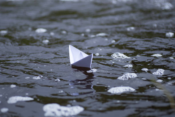 istock Origami paper boat 693433324