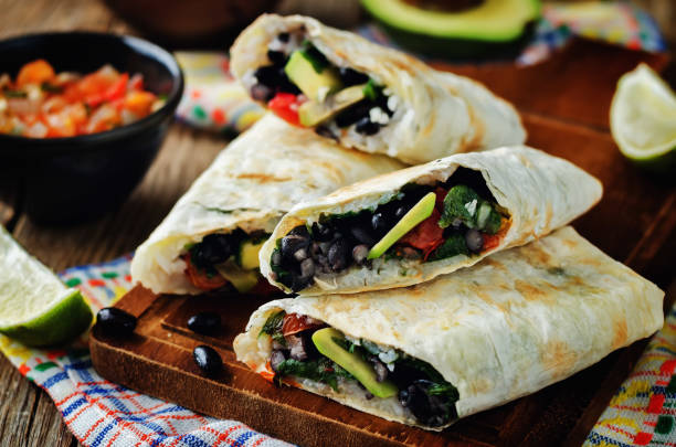 istock Rice black bean avocado tomato burritos 693433468