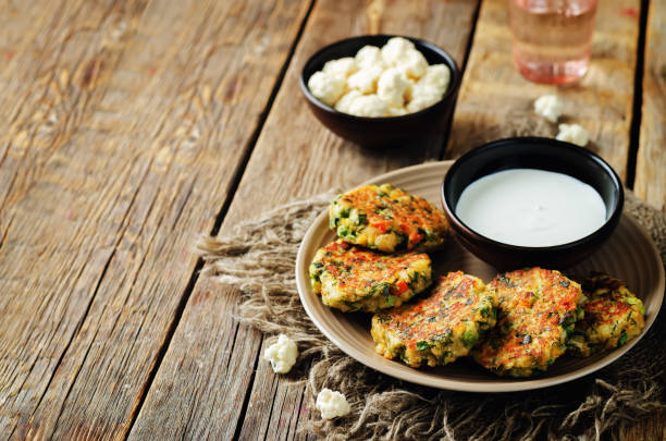 istock Cauliflower carrot green peas dill fritters 693433540