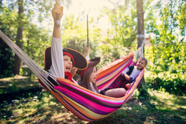 istock Kid pirates playing on a hammock boat 693436076
