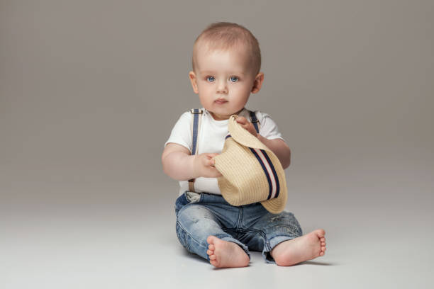 adorable little baby boy posing. - fashion model small one person happiness imagens e fotografias de stock